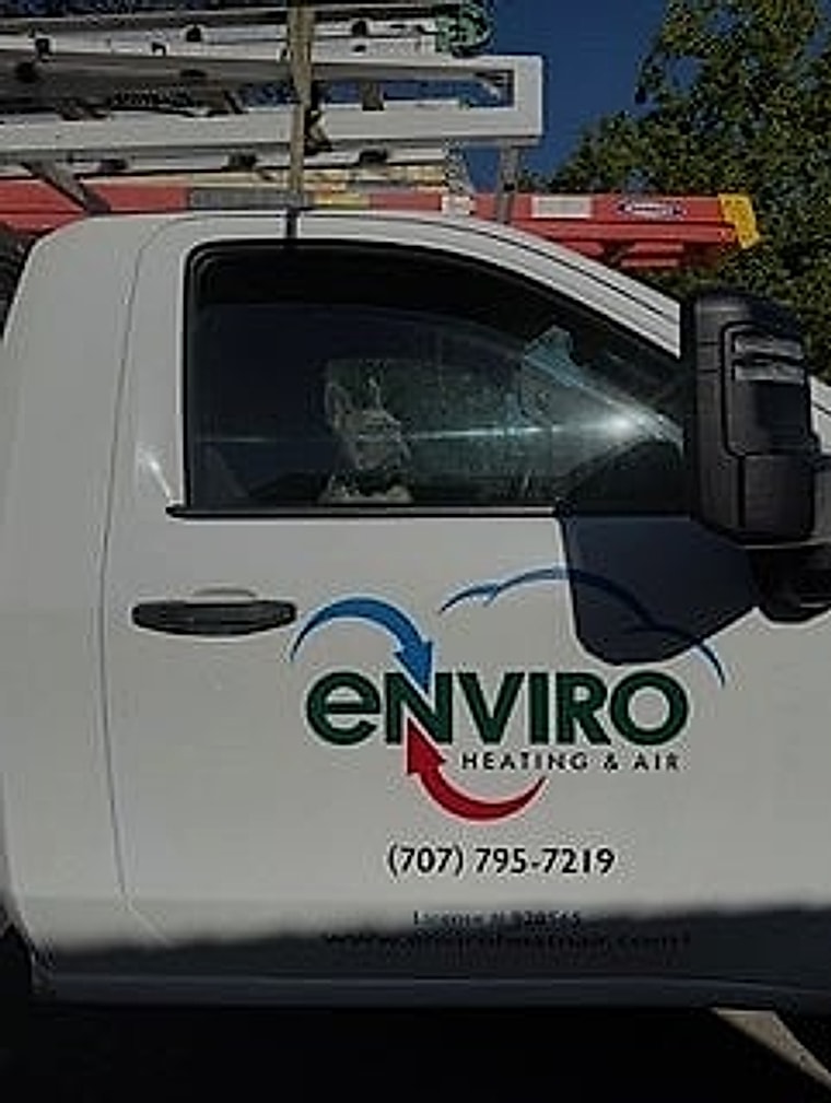 Enviro Heating & Air Conditioning truck door showing the company logo and phone number (707) 795-7219
